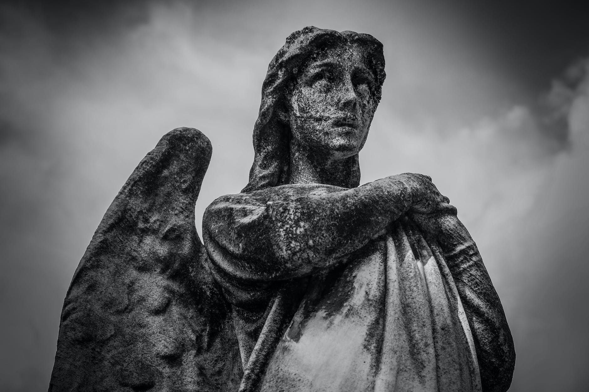 woman with wings statue grayscale photo